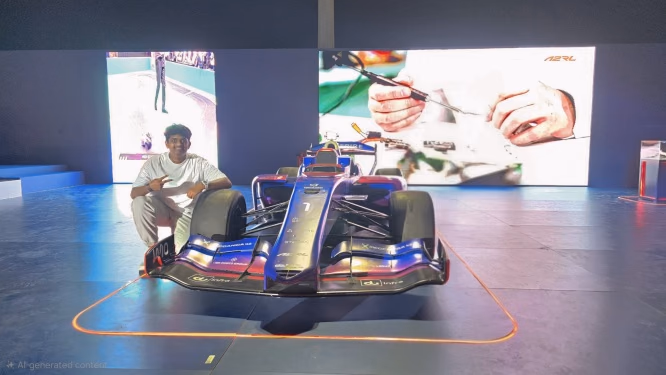 Viswes crouched beside a blue and purple A2RL autonomous Formula-style race car under neon lighting